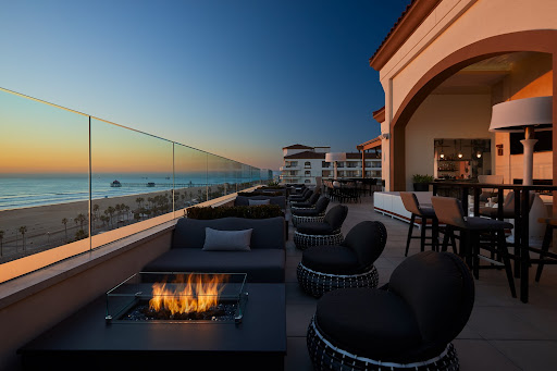 Hotel restaurant and bar overlooking beach sunset